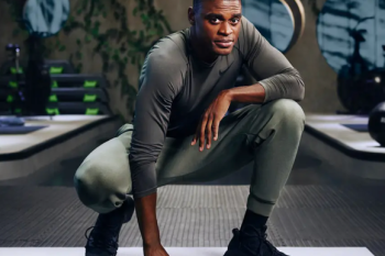 Photo of Joe Holder crouched down at a gym